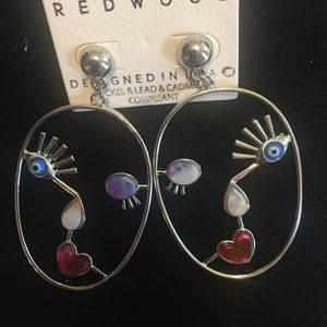 Silver tone lady face earrings